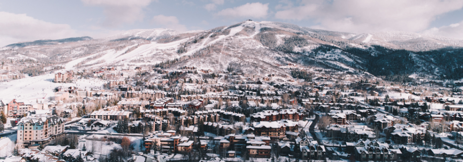 Downtown Steamboat Springs and Mount Werner from the air, covered in snow